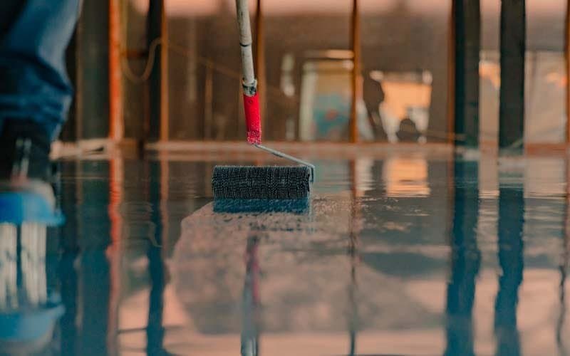 Epoxy coating application — roller applying wet epoxy coat, FraserPlus Epoxy Surrey
