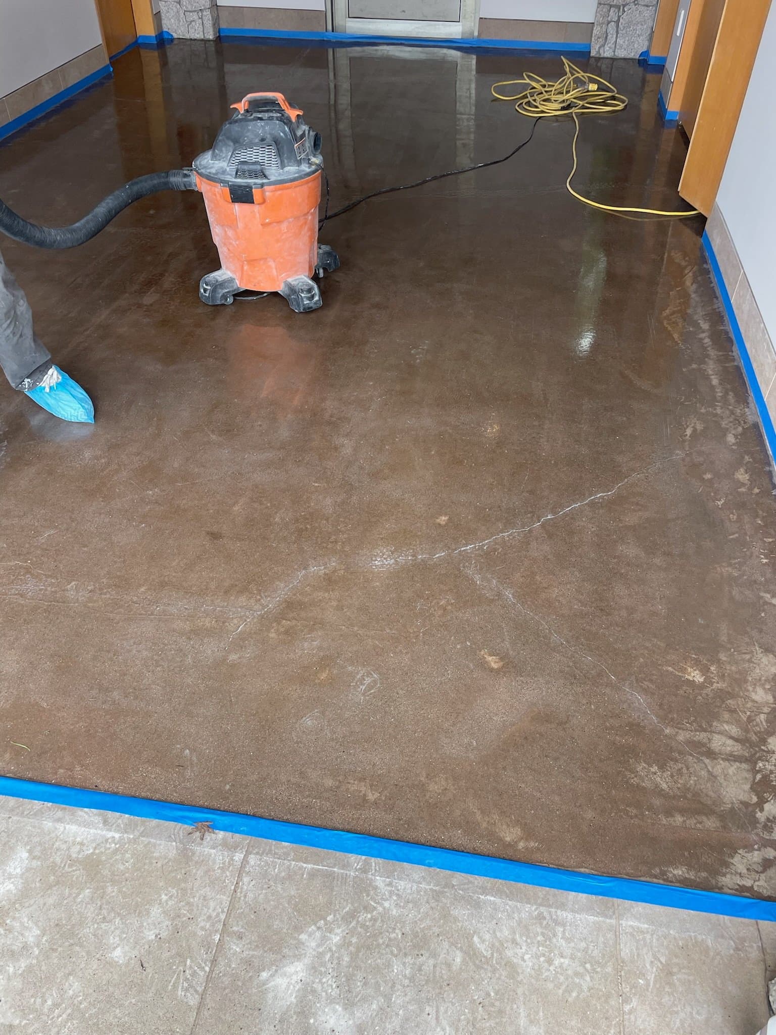 Concrete surface preparation — grinding and vacuuming before epoxy, FraserPlus Epoxy