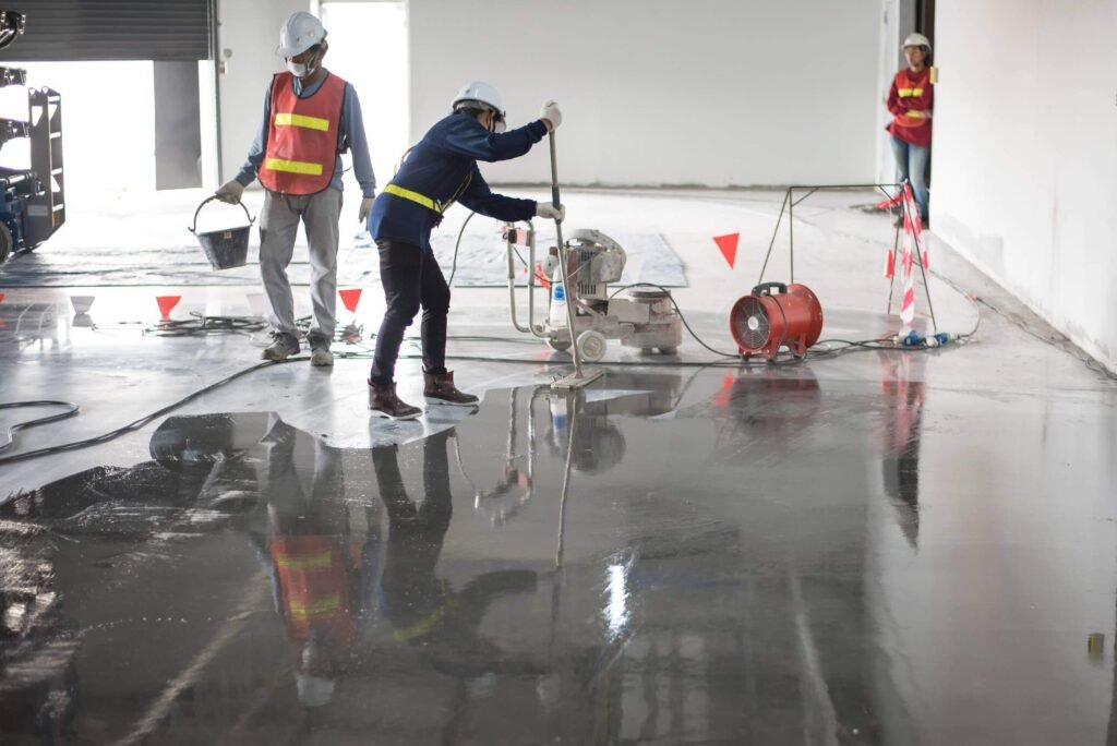A group of workers are working on durable epoxy floors in Vancouver - FraserPlus Epoxy Flooring installation process